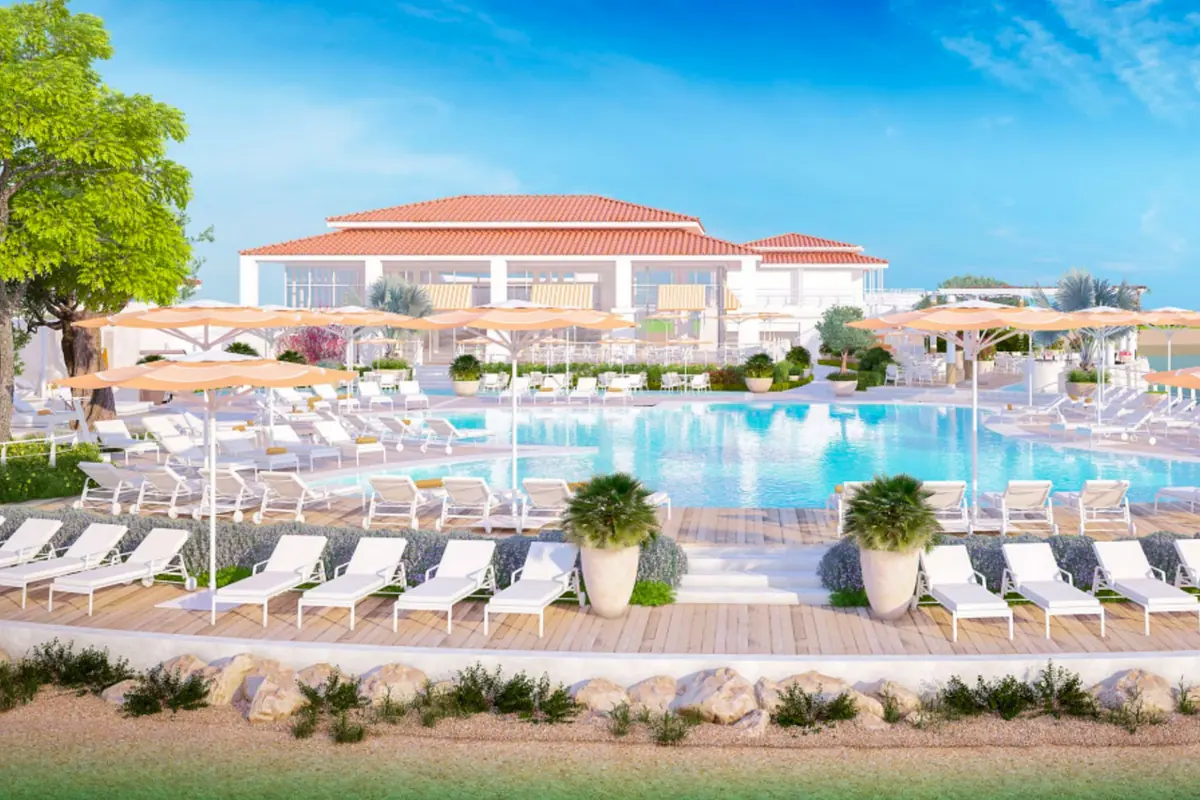 Jumeirah Islands Clubhouse beside the water, with outdoor seating under canopies